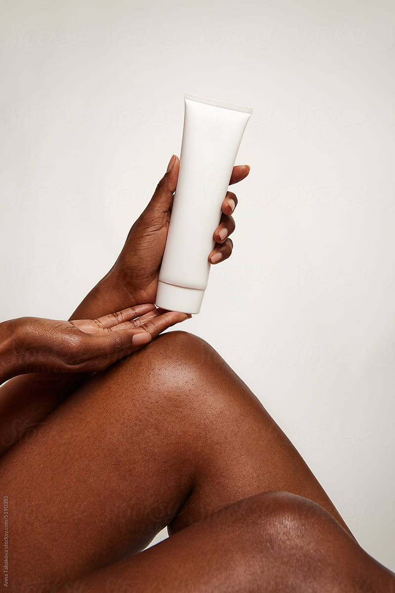 Woman holding a skincare product