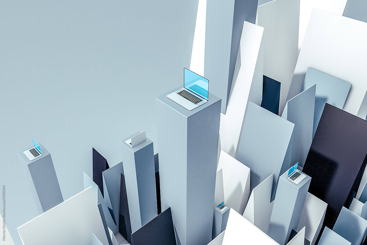 Laptop on Tower Surrounded by White and Blue Objects