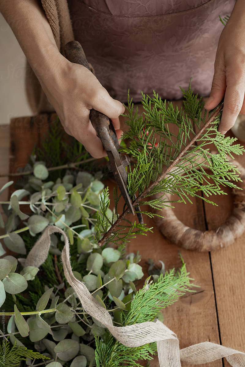 Making A Christmas Wreath With Branches And Leaves