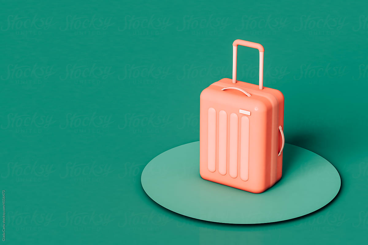 pink suitcase on circular pedestal on green background