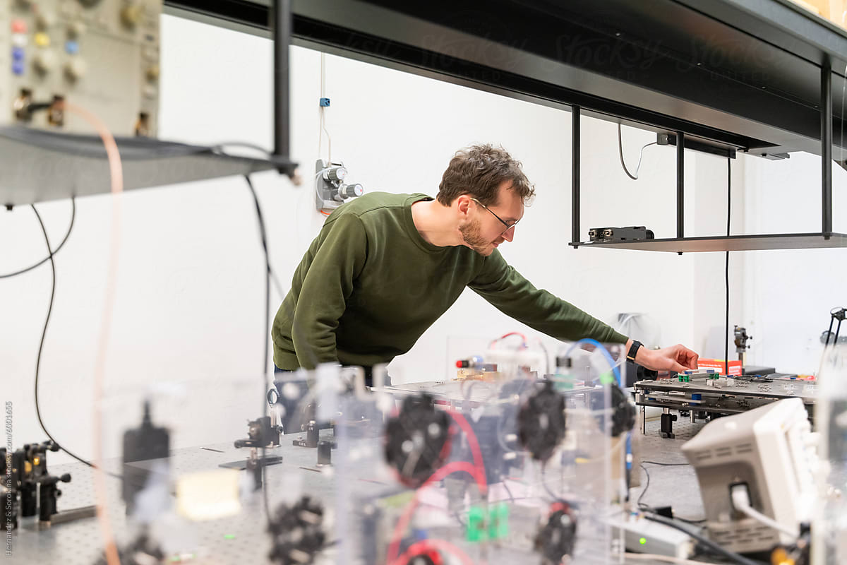 Scientist Working With Fiber Laser Experiment