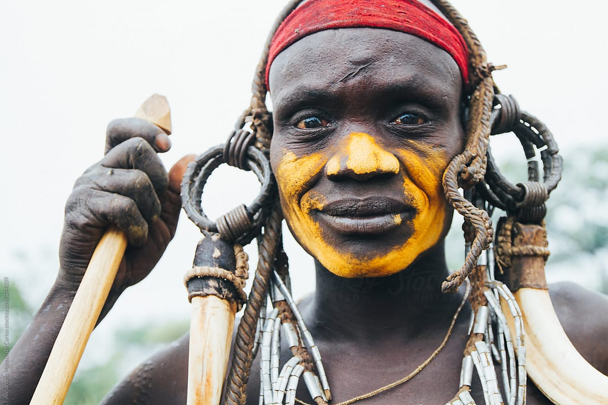 Mursi tribe man portrait with traditional clothes. Mago National park, Ethiopia, Africa