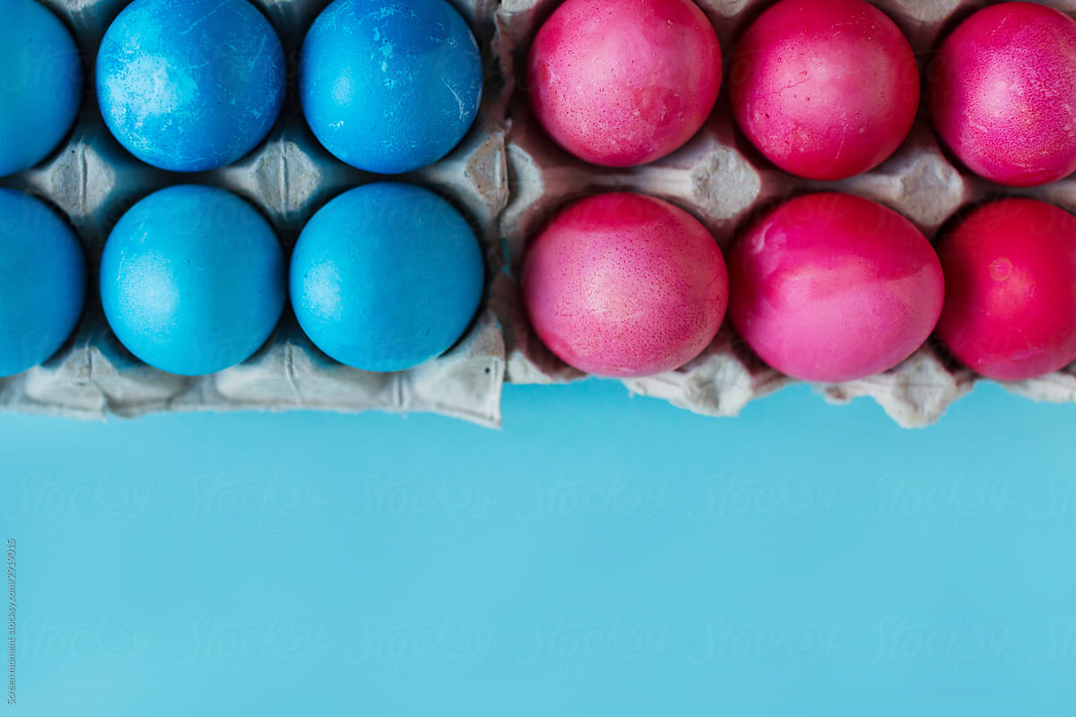 Blue and pink Easter eggs in the package on blue background