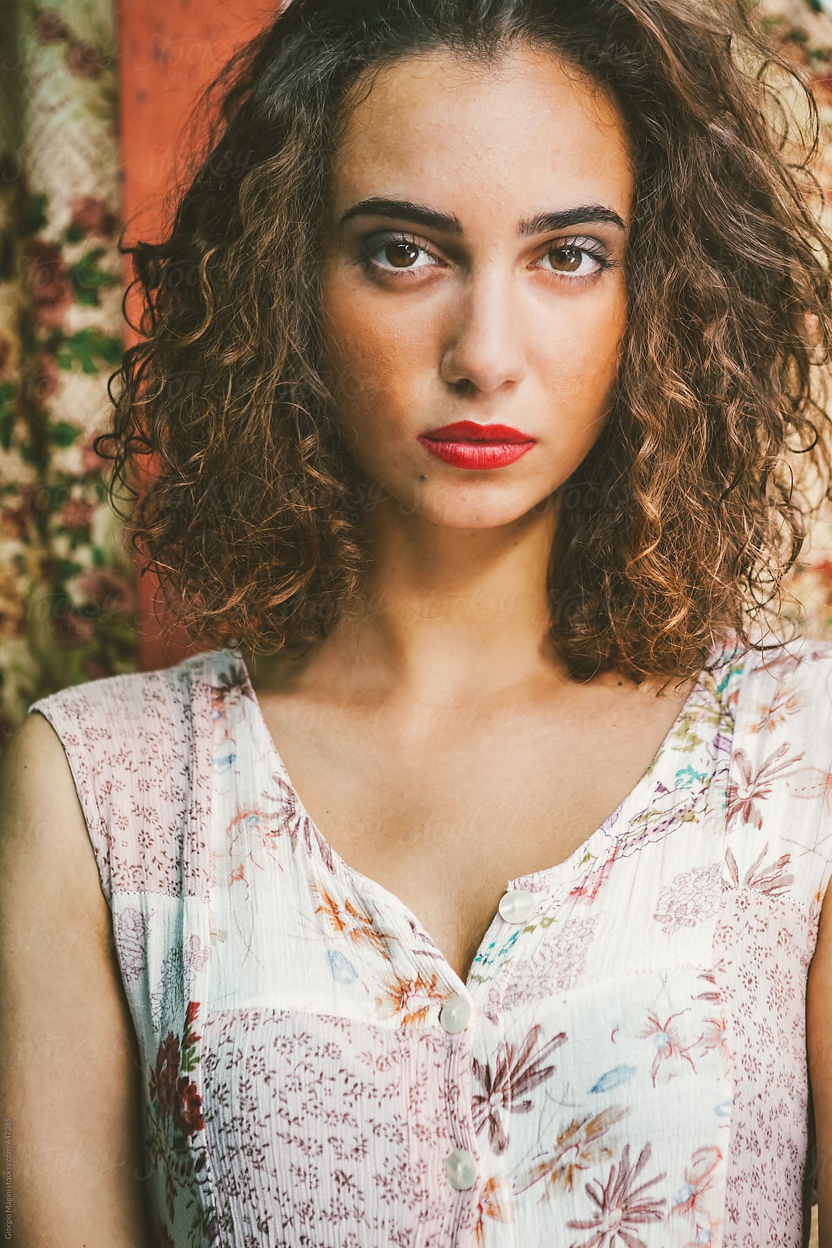 Portrait Of A Beautiful Young Woman With A Vintage Floral Dress By