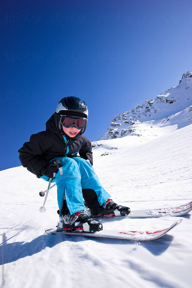 Young boy snow skiing downhill