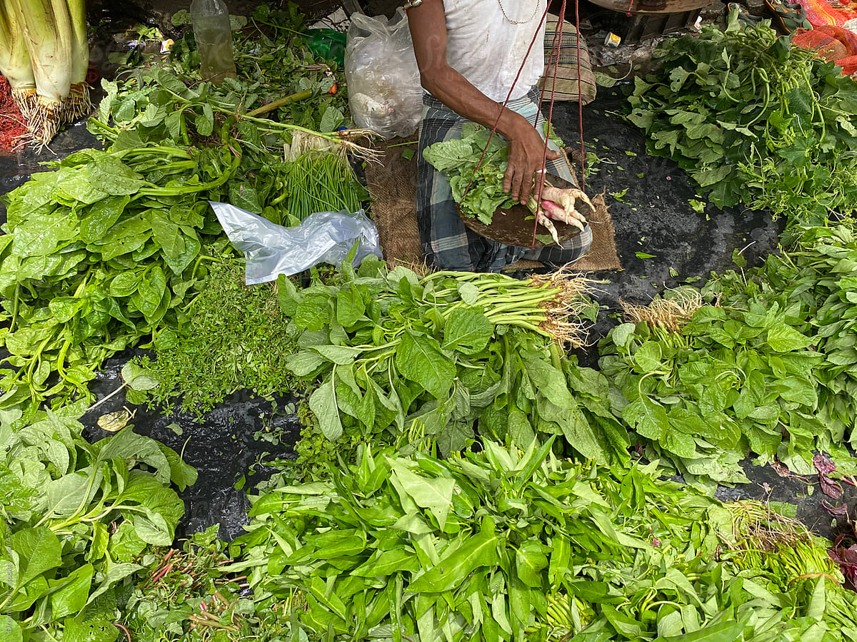 A vegetable seller selling organic vegetables in a little shop