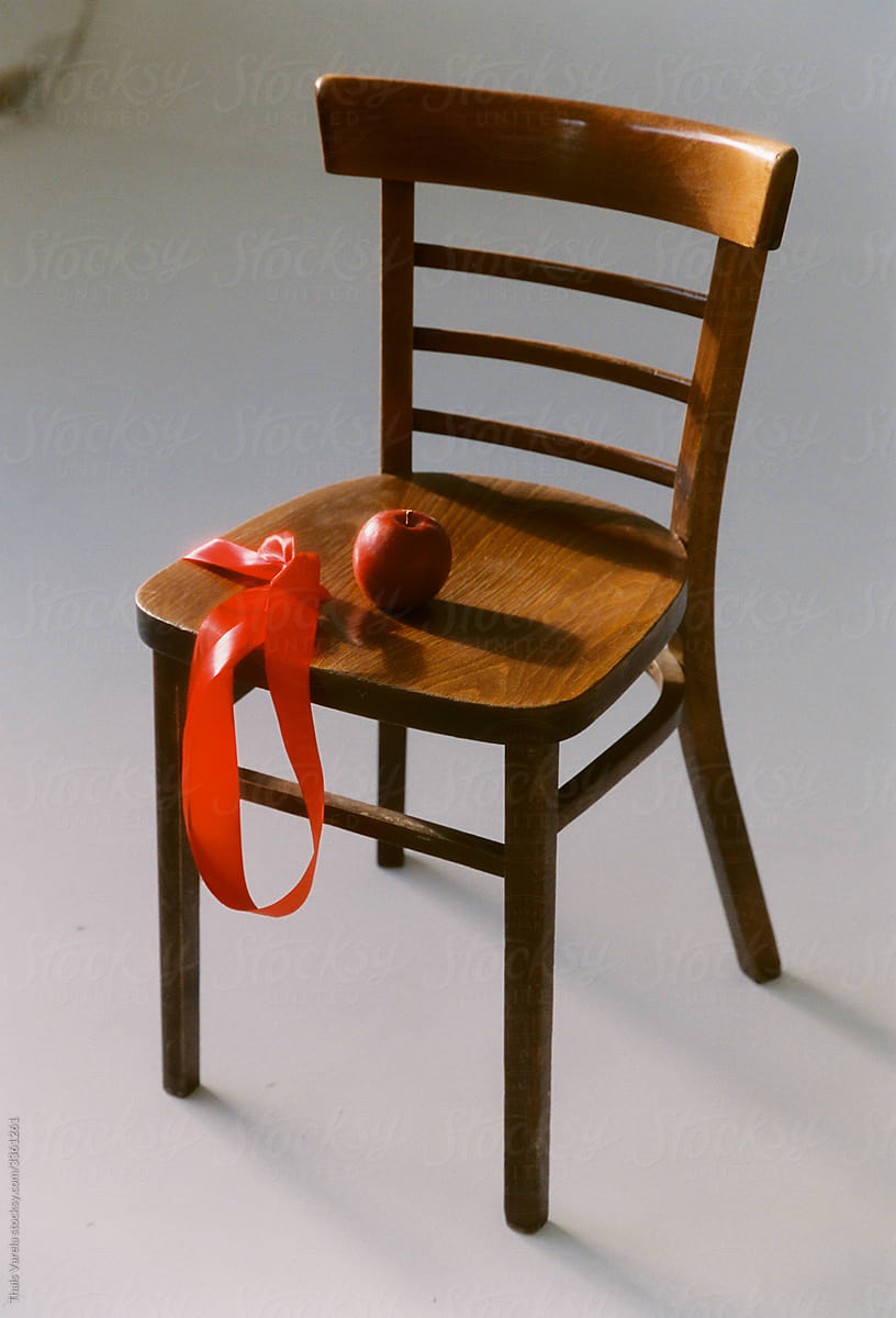 red apple on a  chair.