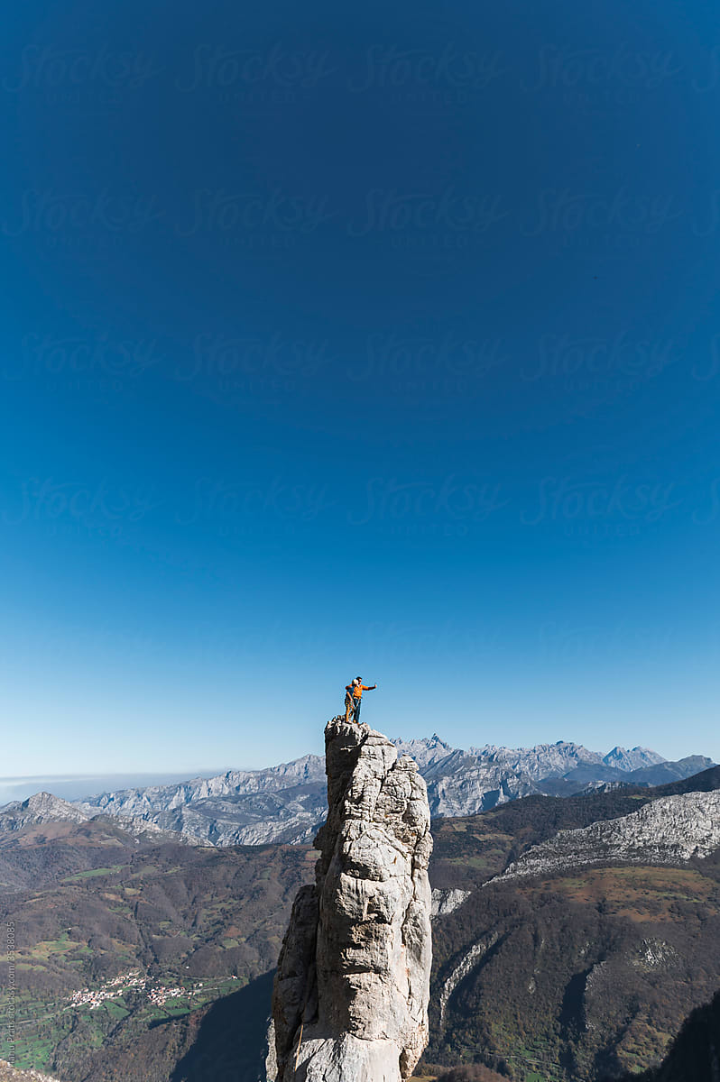 Climbers taking selfie on top of pinnacle
