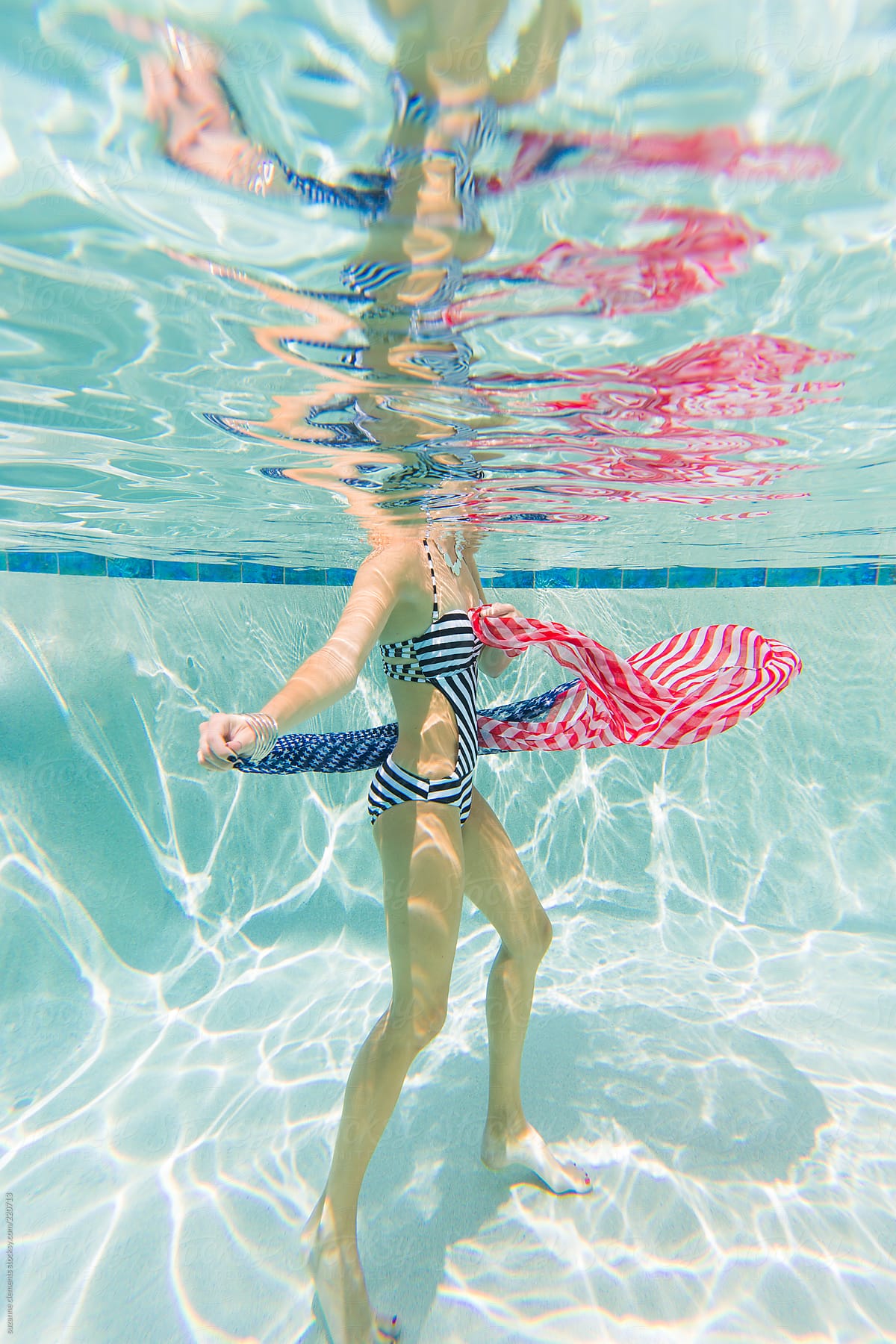 Woman with American Flag Underwater