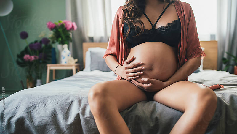 Pregnant Woman Holding Her Stomach