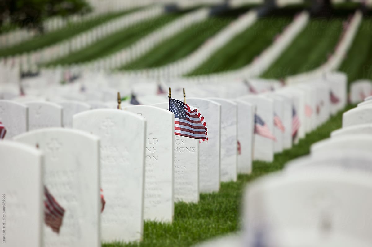 Memorial: American Flags Placed At Headstones In Military Cemetary