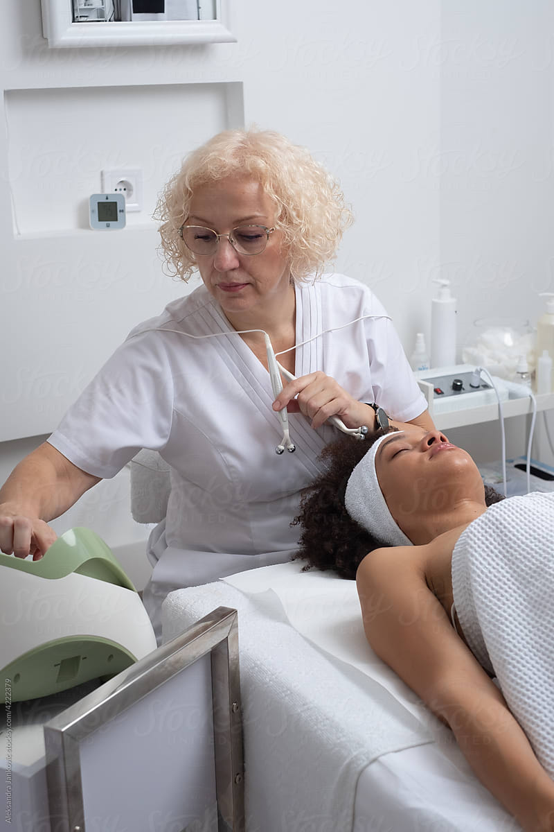 Skin Care Therapist Working With A Client