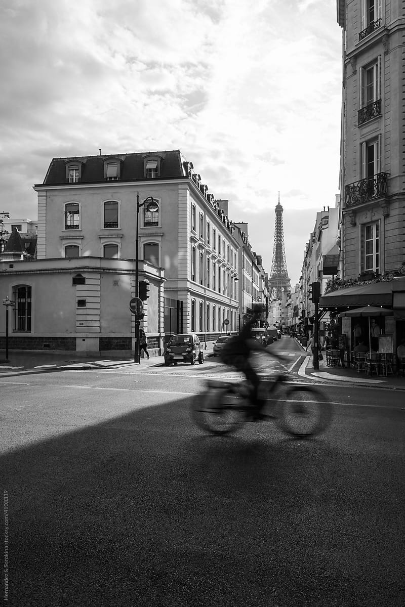 Bicyclist Crossing Street With Eiffel Tower View