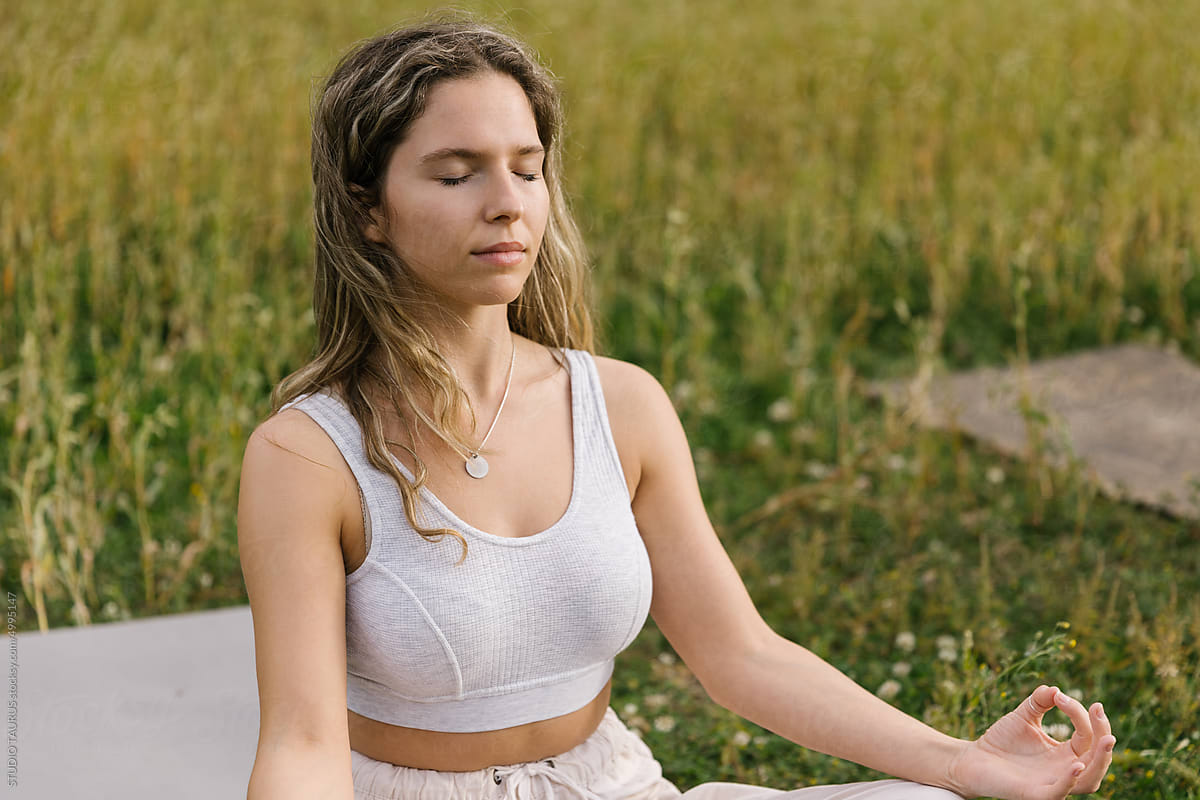 Woman Focused On Meditation, Practising Yoga In Nature