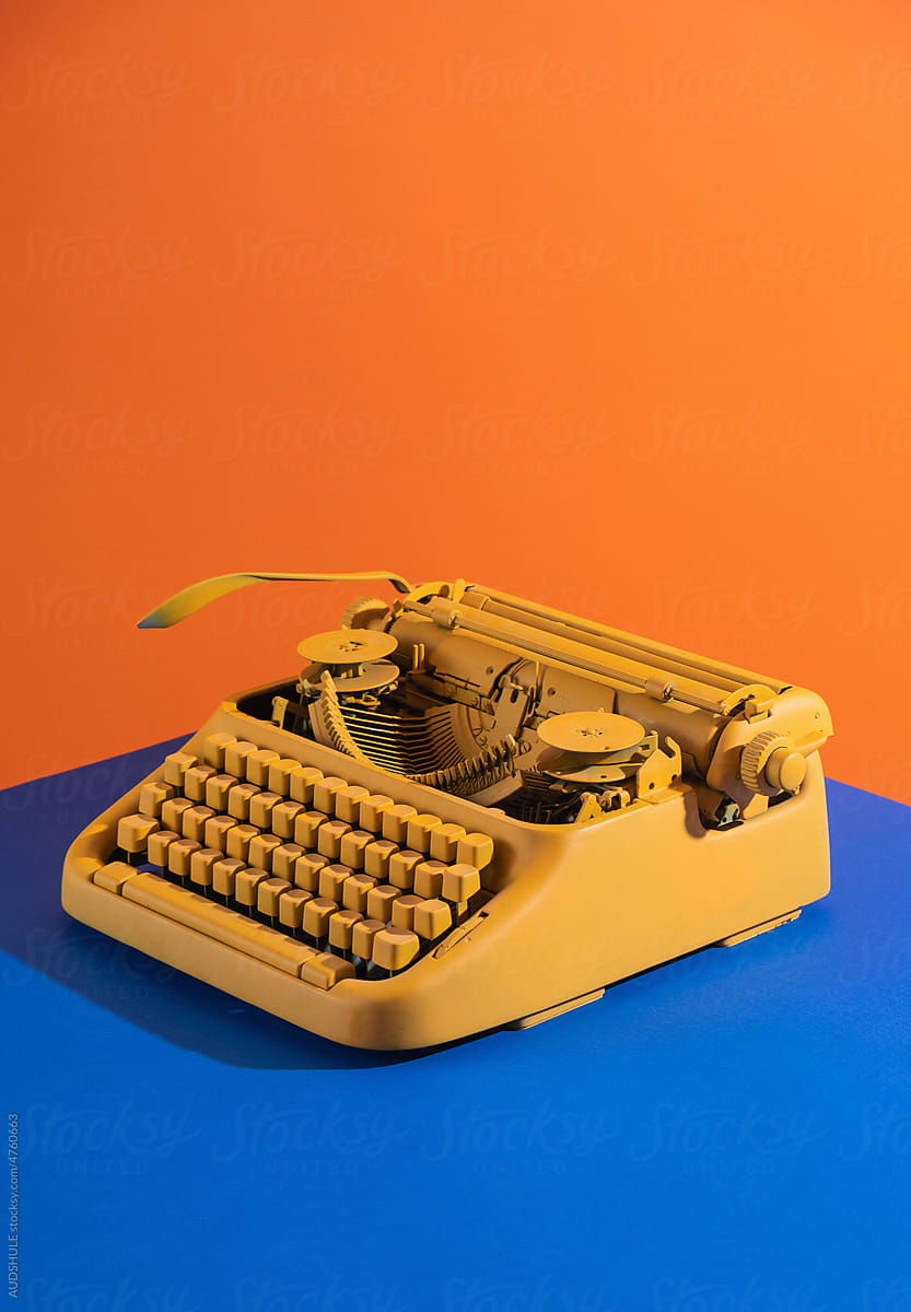 yellow typing machine  blue  orange