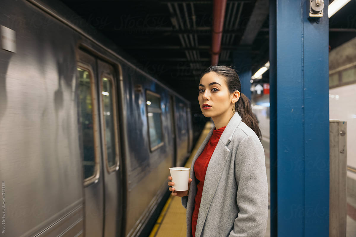 Businesswoman waiting for the train on the subway platform