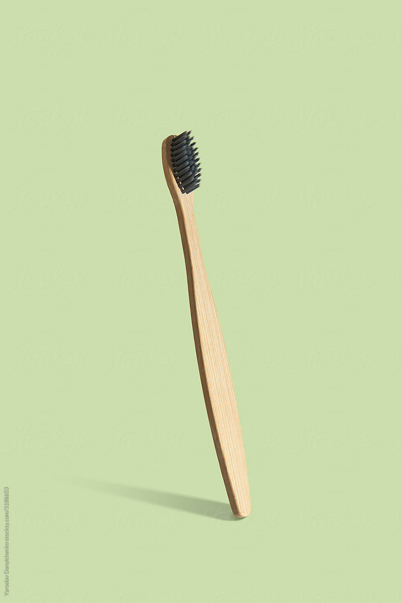 Natural wooden toothbrush vertical balancing.