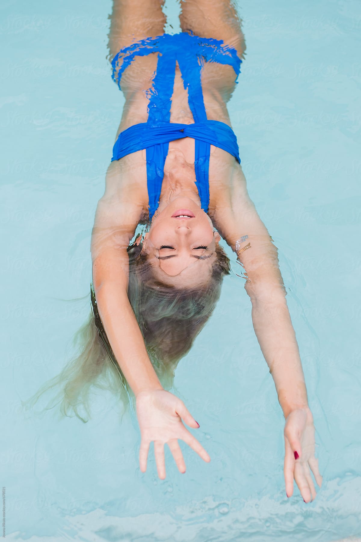 Young woman floating in water