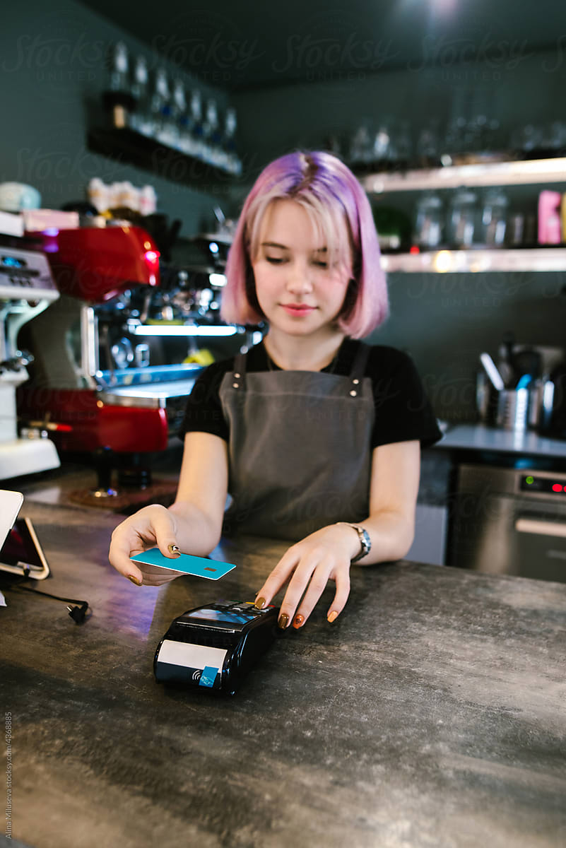 Bartender making contactless payment on eftpos