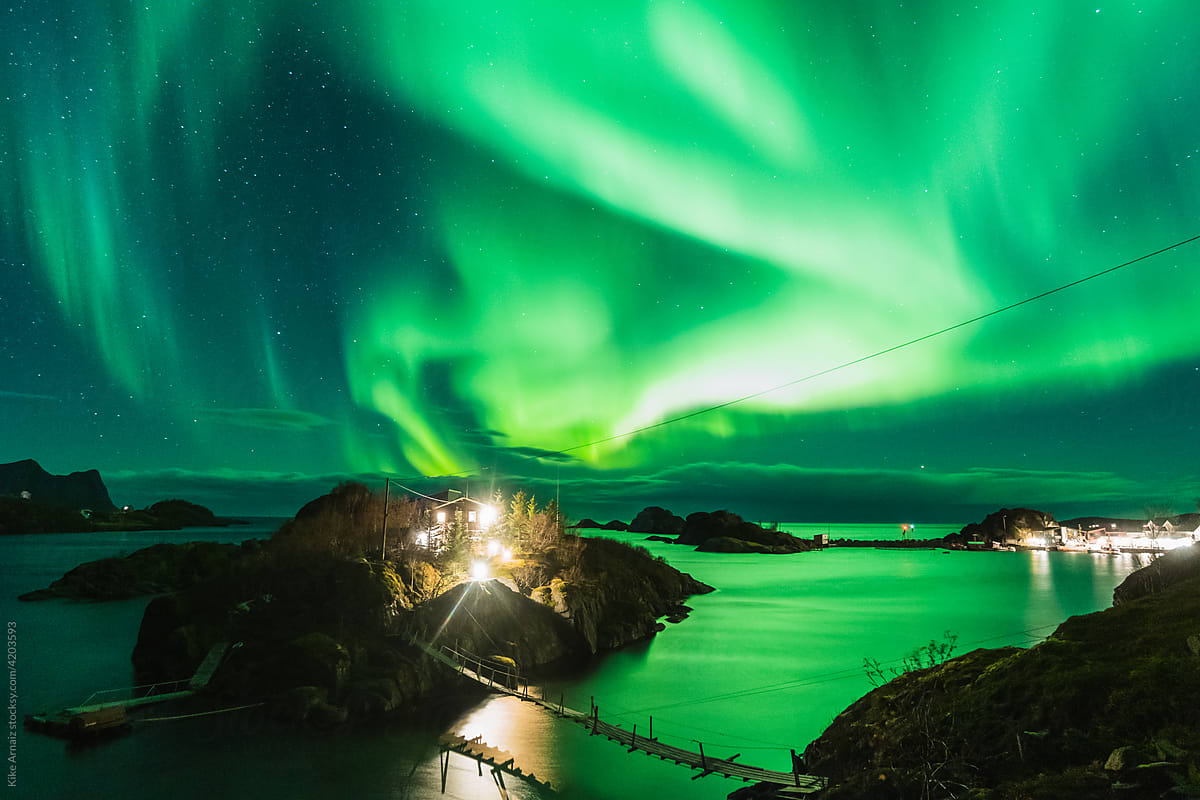 Northern lights over fjord in Norway