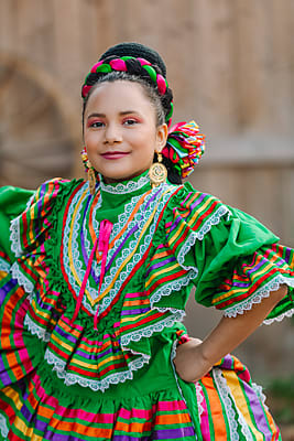 Portrait Girl Dressed Up With A Traditional Mexican Dress And Braid  Hairstyle