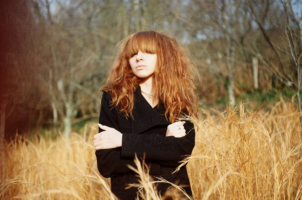Gritty Redhead woman in countryside