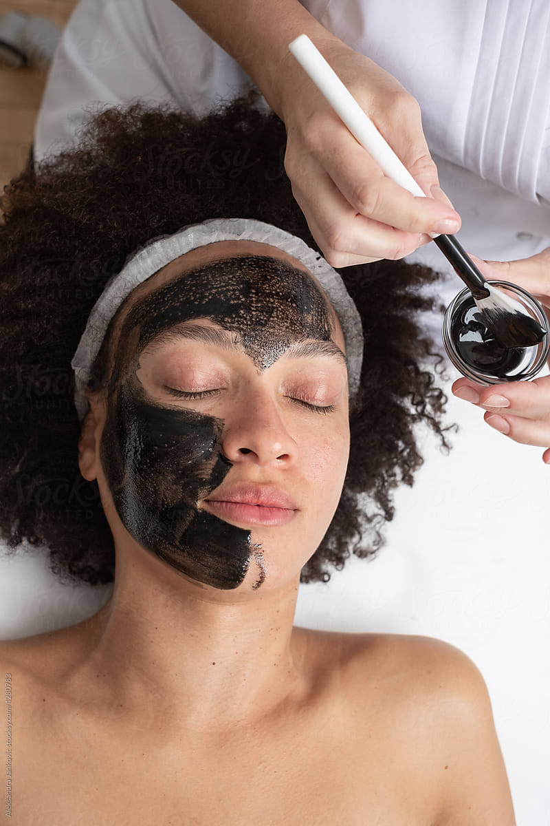 Woman Having Carbon Mask Treatment In The Beauty Salon