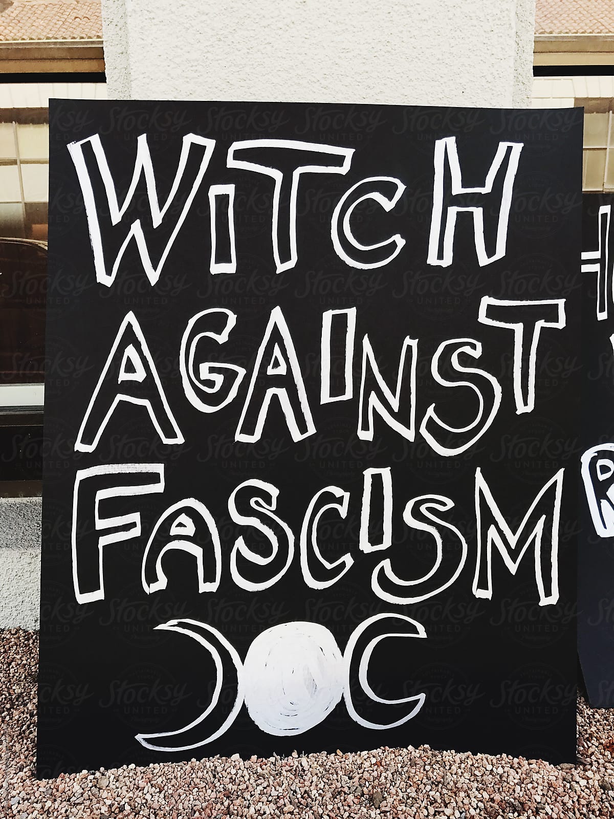 Witch against facism protest sign