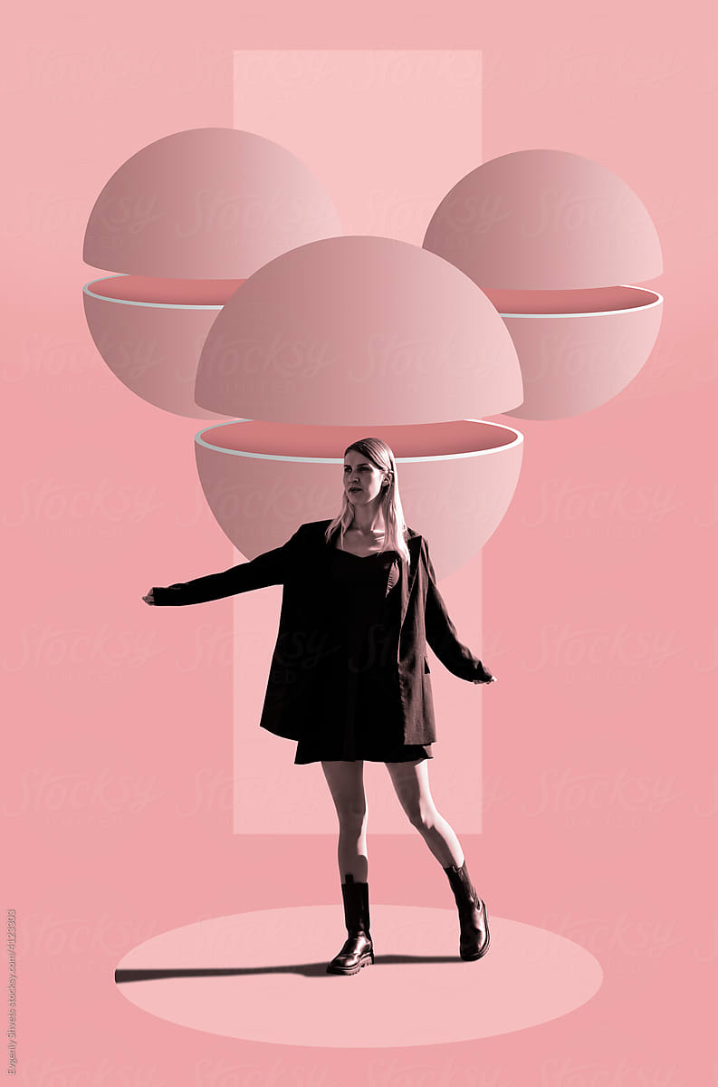 Young Woman Standing Against Group Of Divided Spheres