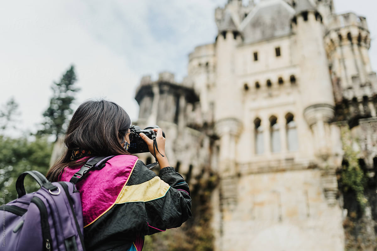Woman shooting photos at a castle