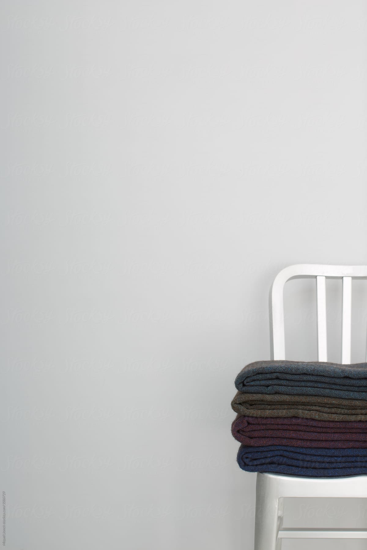 Metallic chair with handmade wool blankets