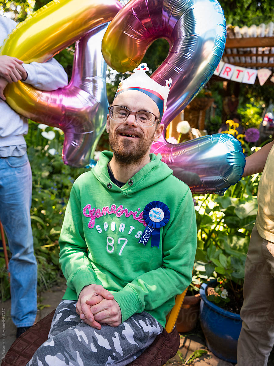 Portrait of man with down syndrome at his birthday