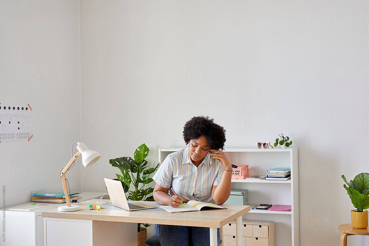 Black businesswoman working in home office