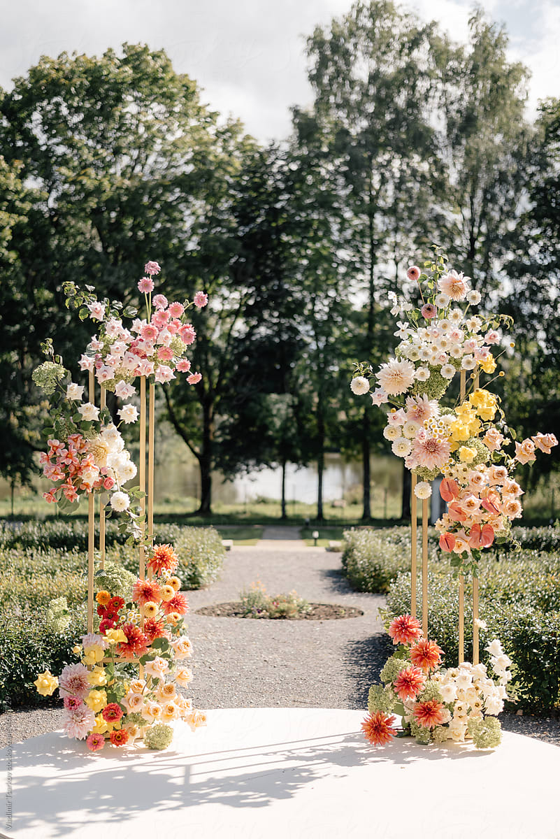 modern style wedding arch with fresh flowers