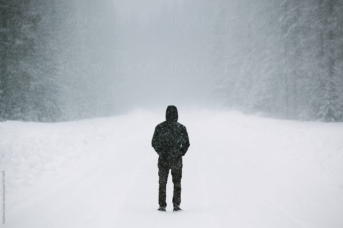 Man on a snow covered backroad