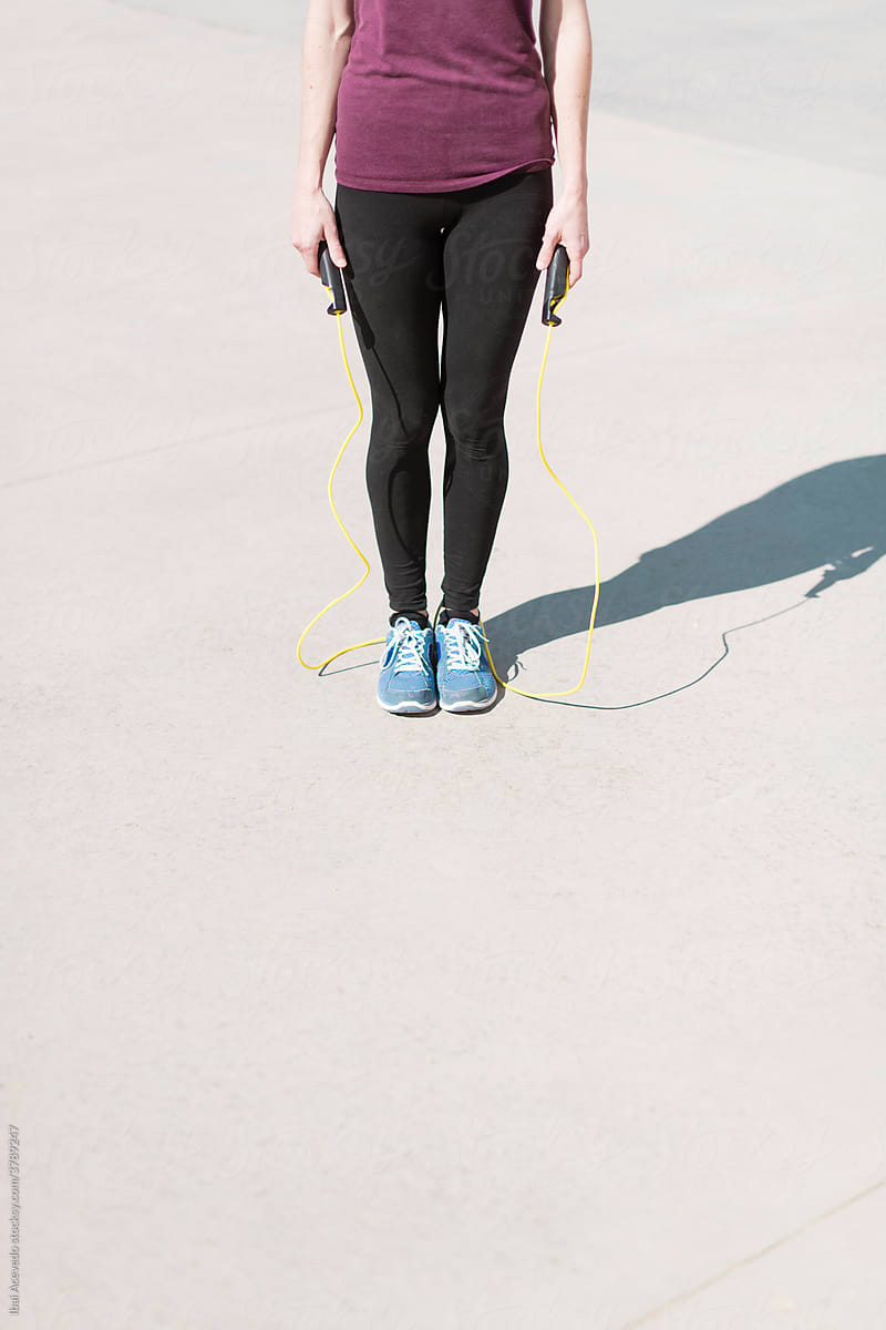 Standing woman with jumping rope