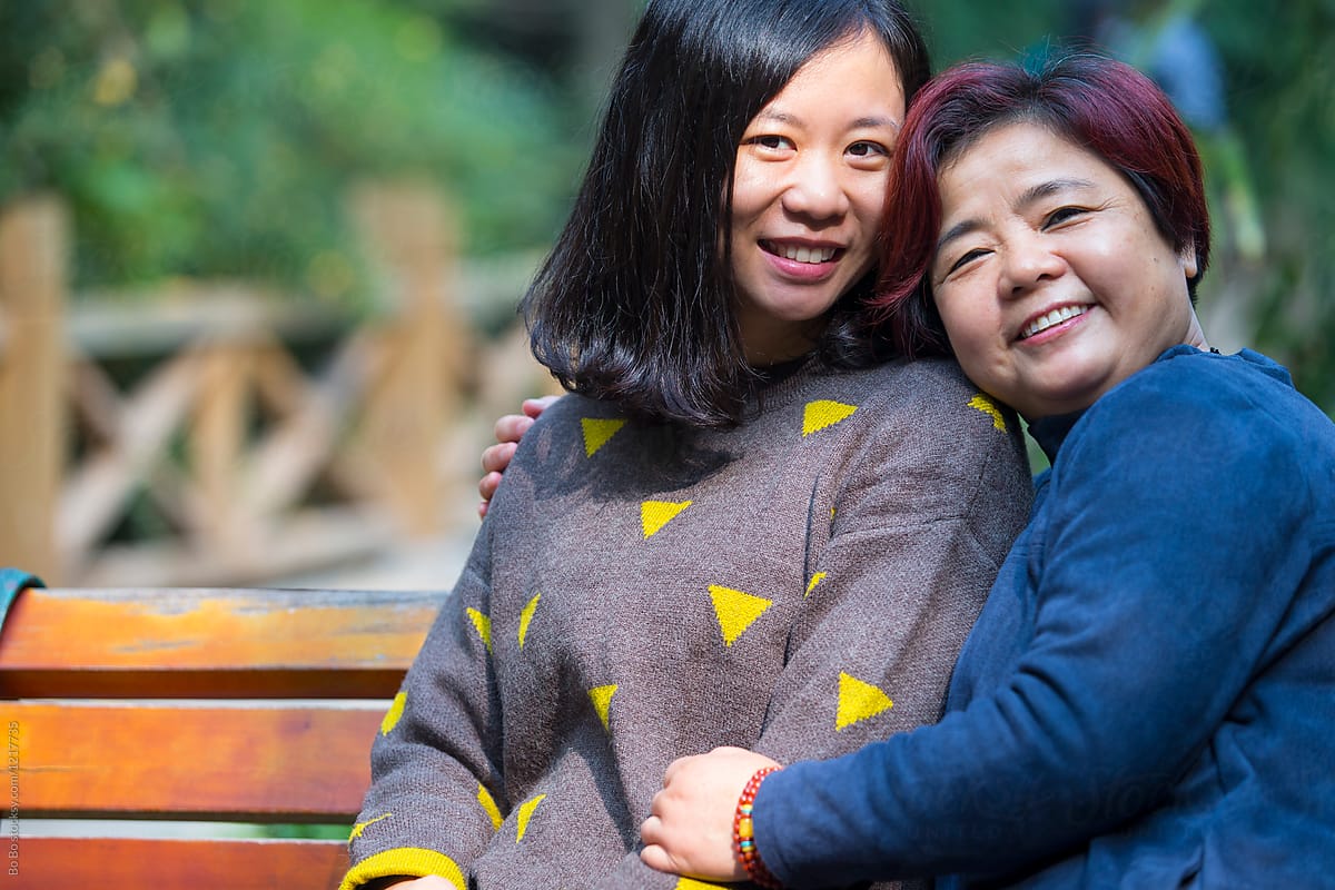 Senior Asian Woman and her Daughter Smile at camera