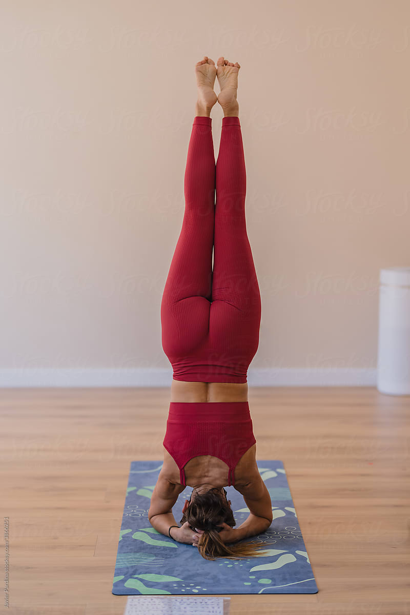 Woman practicing yoga at class