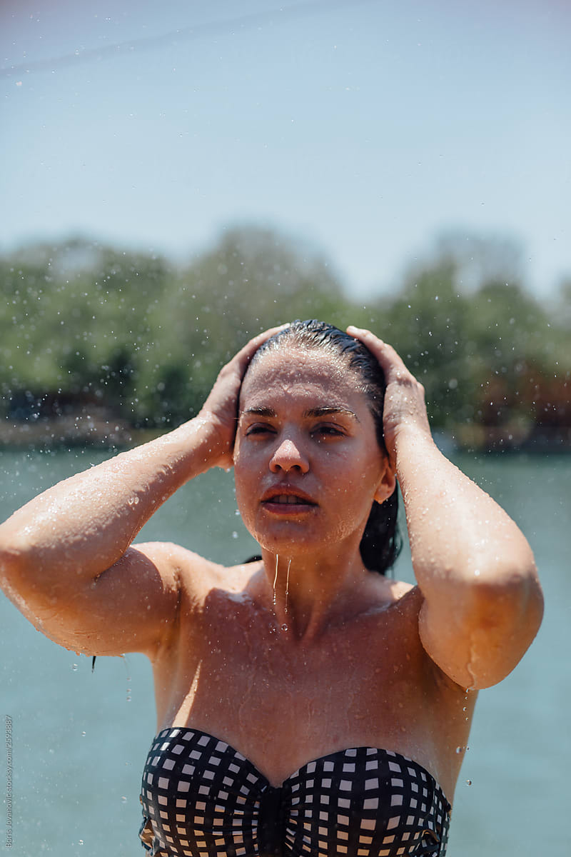 Woman having a shower outdoor