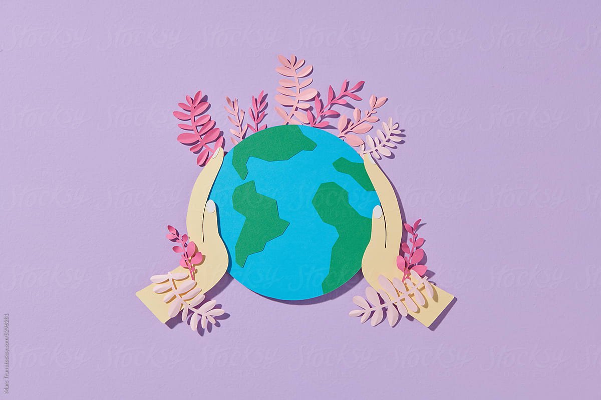 A globe with flowers in paper cut and craft style
