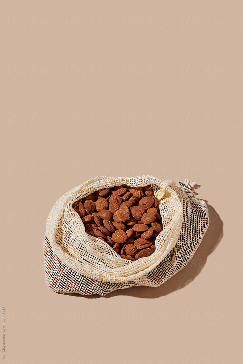 shelled almonds in a textile mesh bag