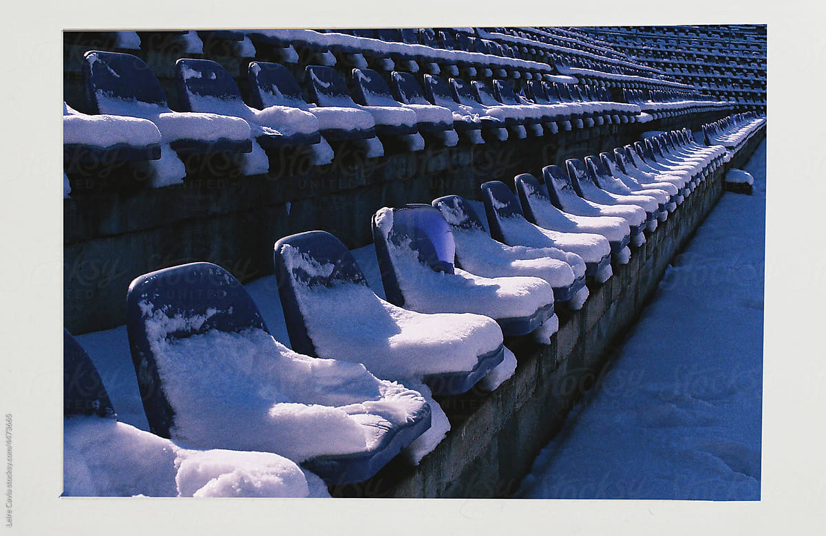 Analogical photo of a stadium seats cover in snow
