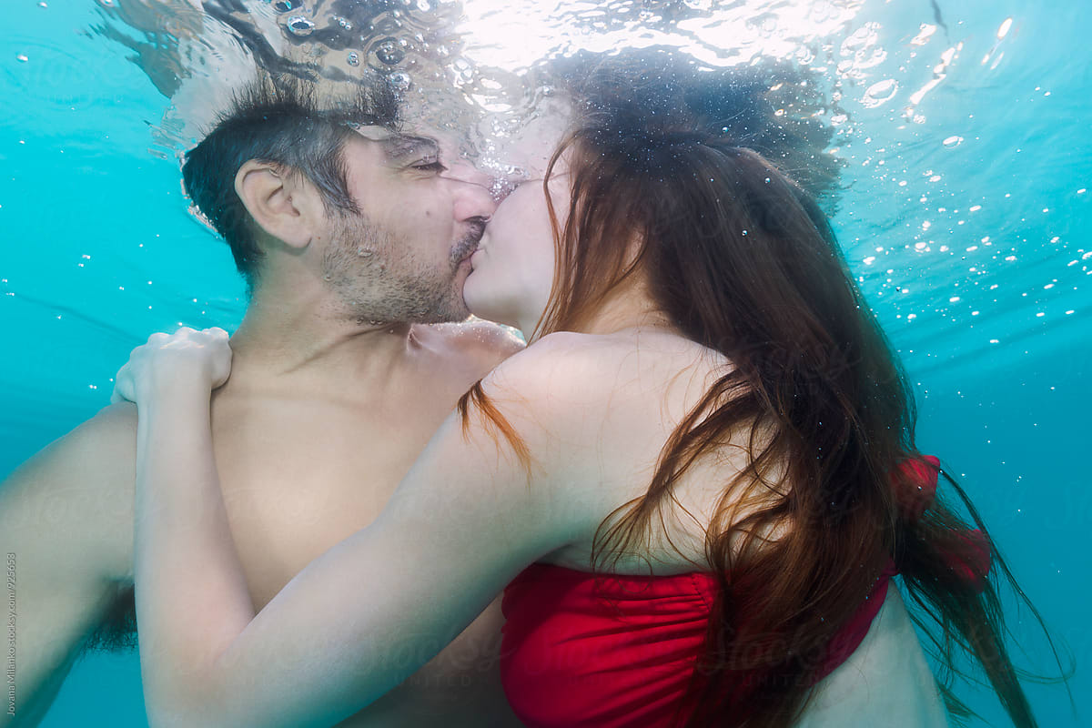Hot couple kissing underwater