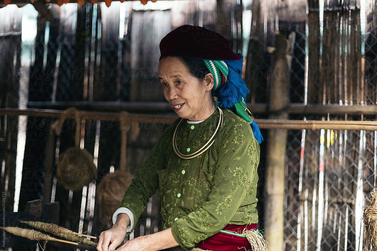 Vietnamese local weaver weaving with hemp
