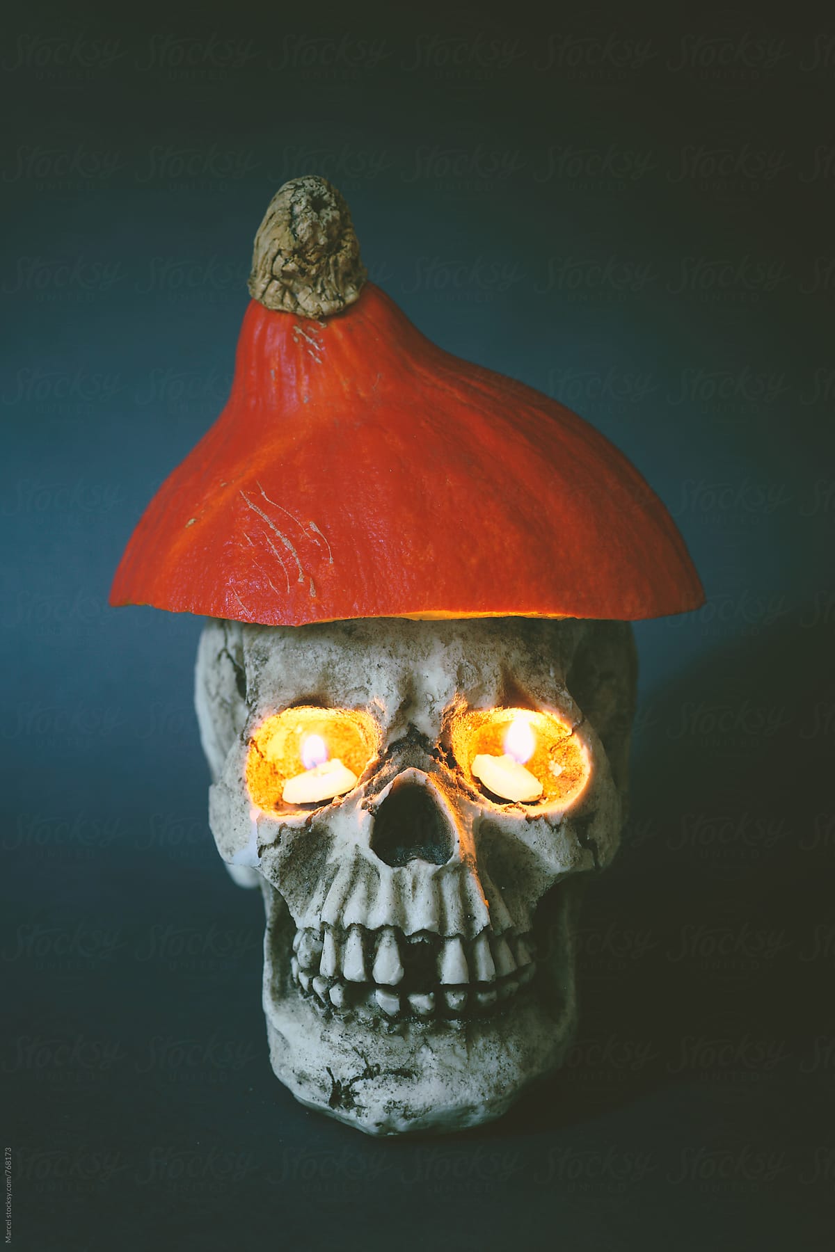 Skull with pumpkin hat and burning eyes