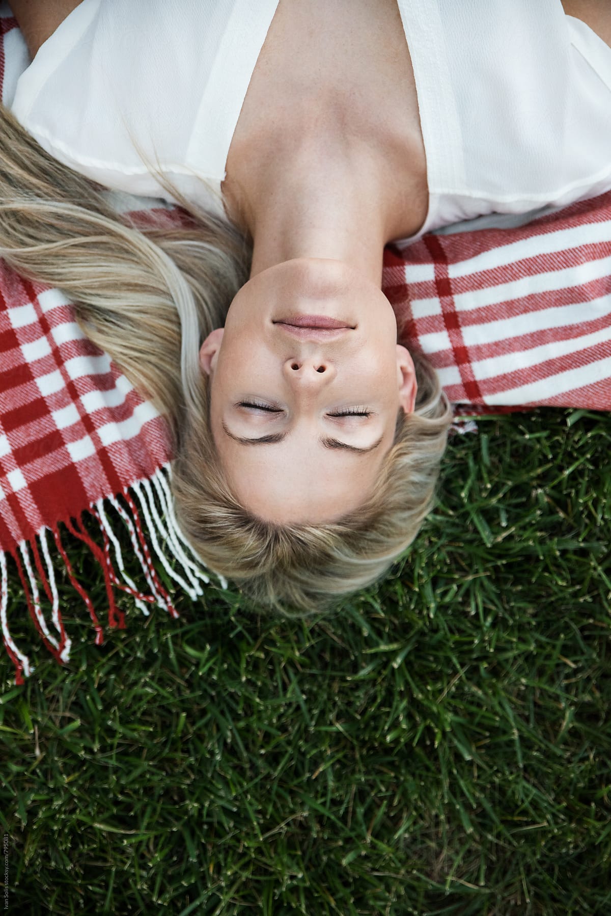 Woman Lying On The Grass By Stocksy Contributor Ivan Solis Stocksy