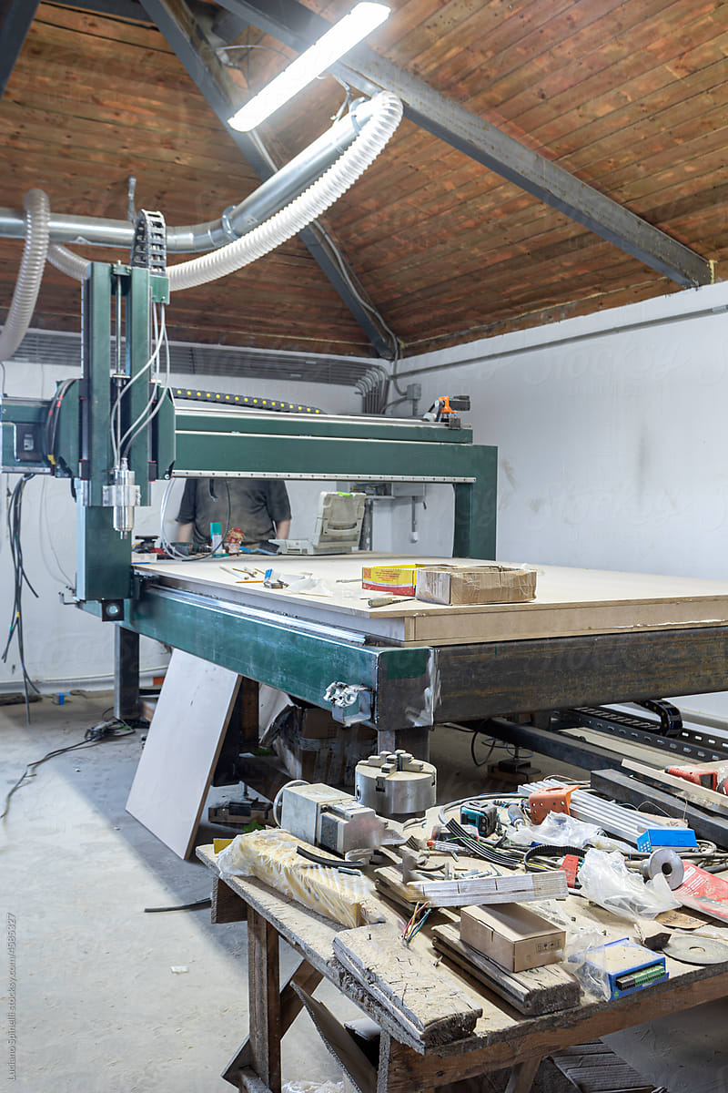 Industrial machine creating a wooden element for kraft furniture