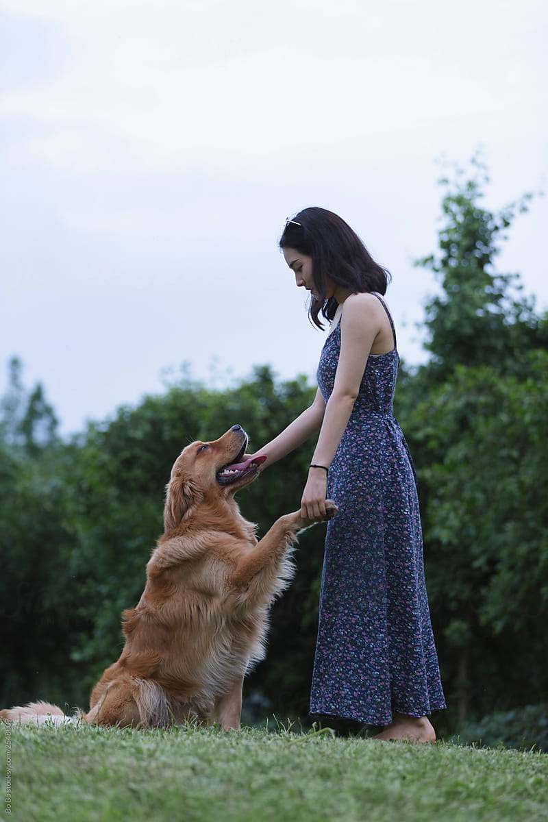 young asian woman with dog outdoor