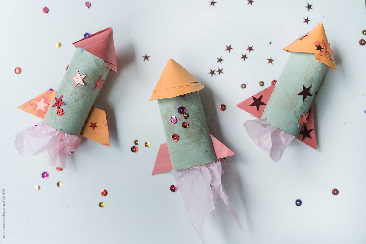 3 children\'s handmade paper rocket ships