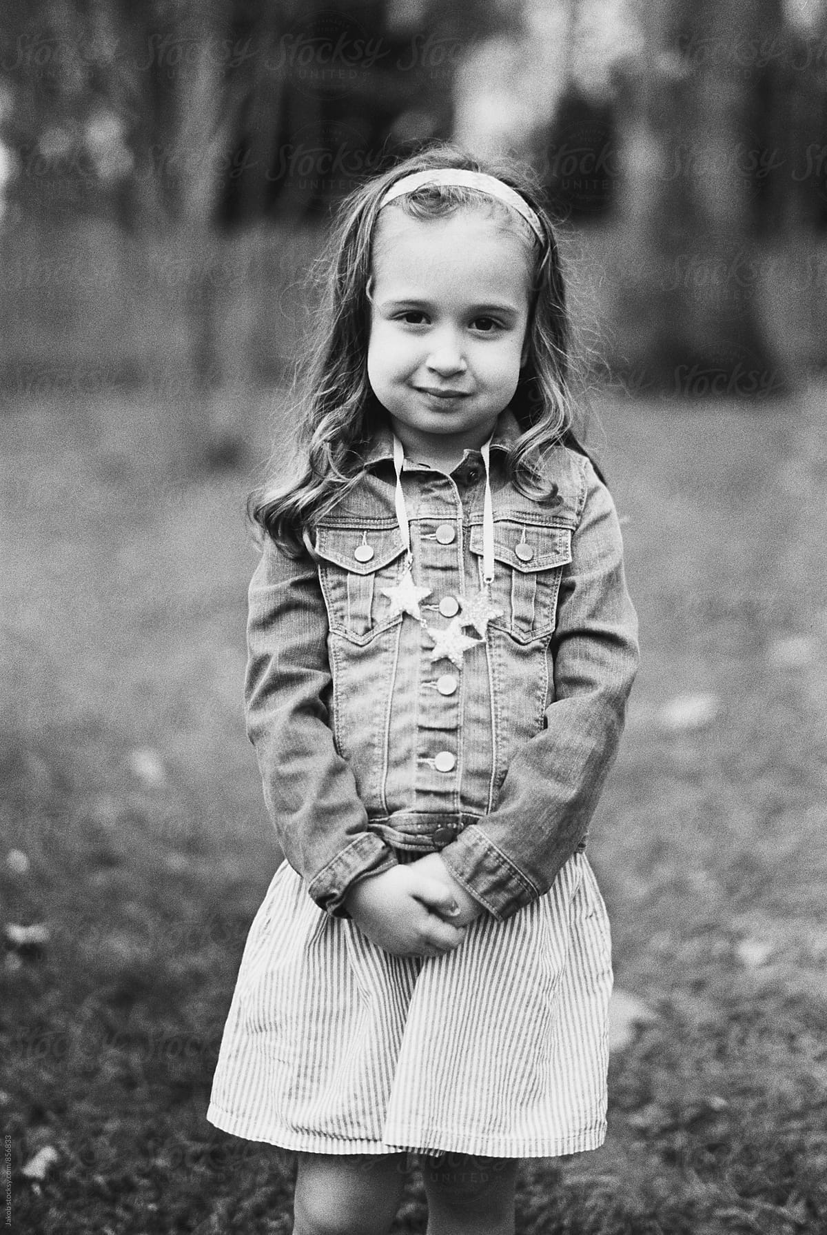 Black And White Portrait Of A Beautiful Young Girl In A Denim Jacket By